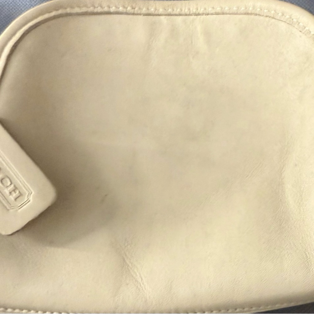 Coach Ivory Leather Crossbody Bag has some stains, sold as is.
